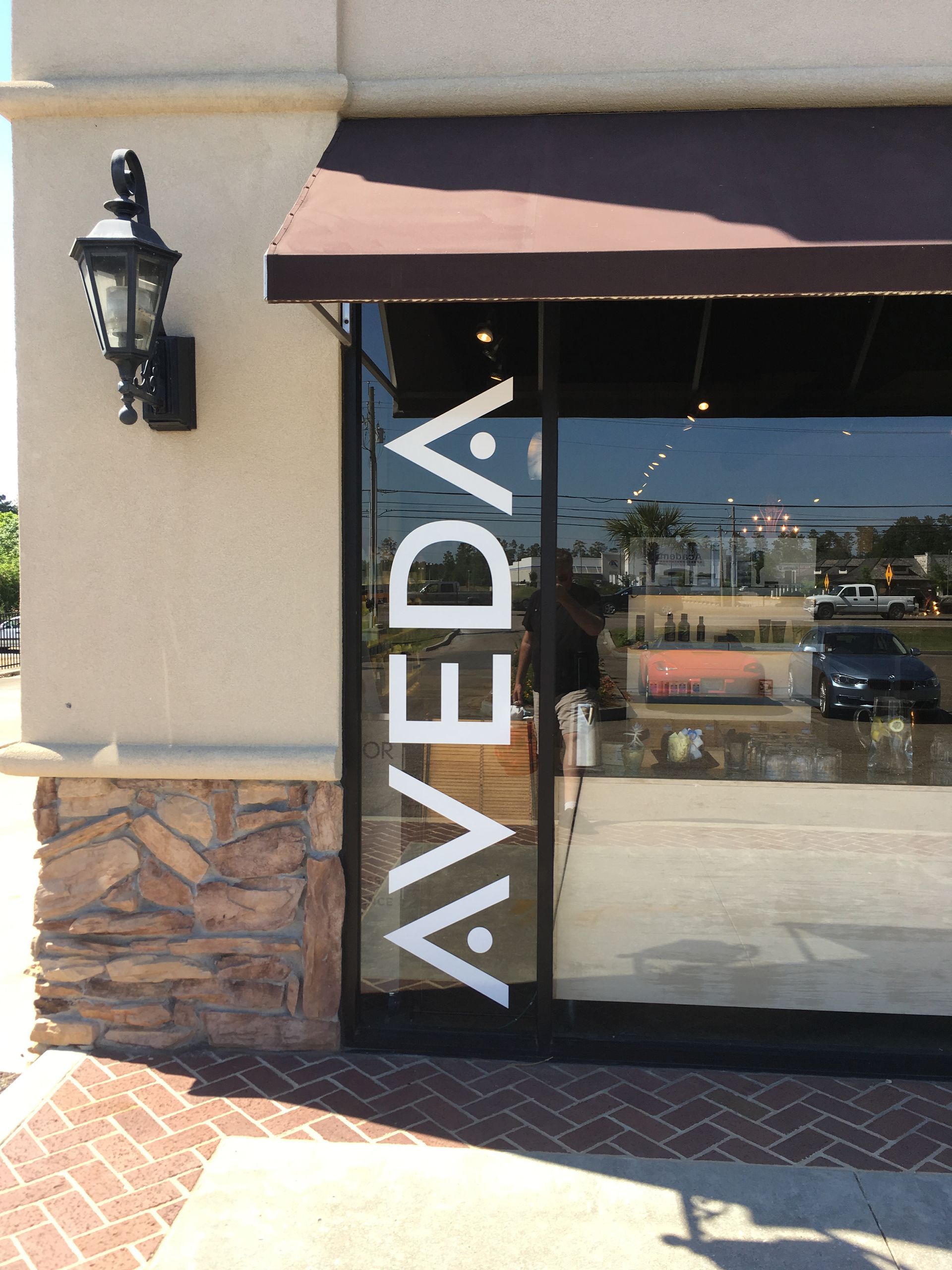 A glass-paneled storefront features the word 