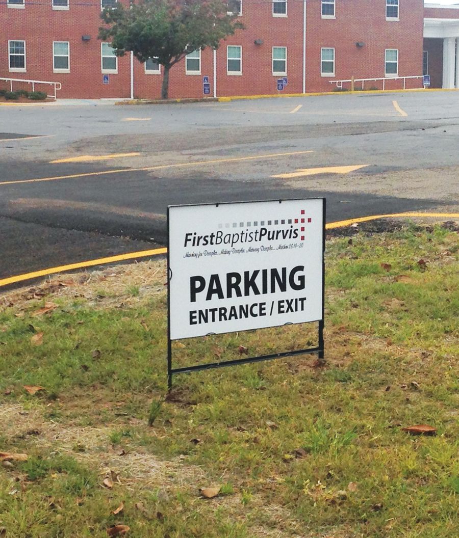 A white sign reading