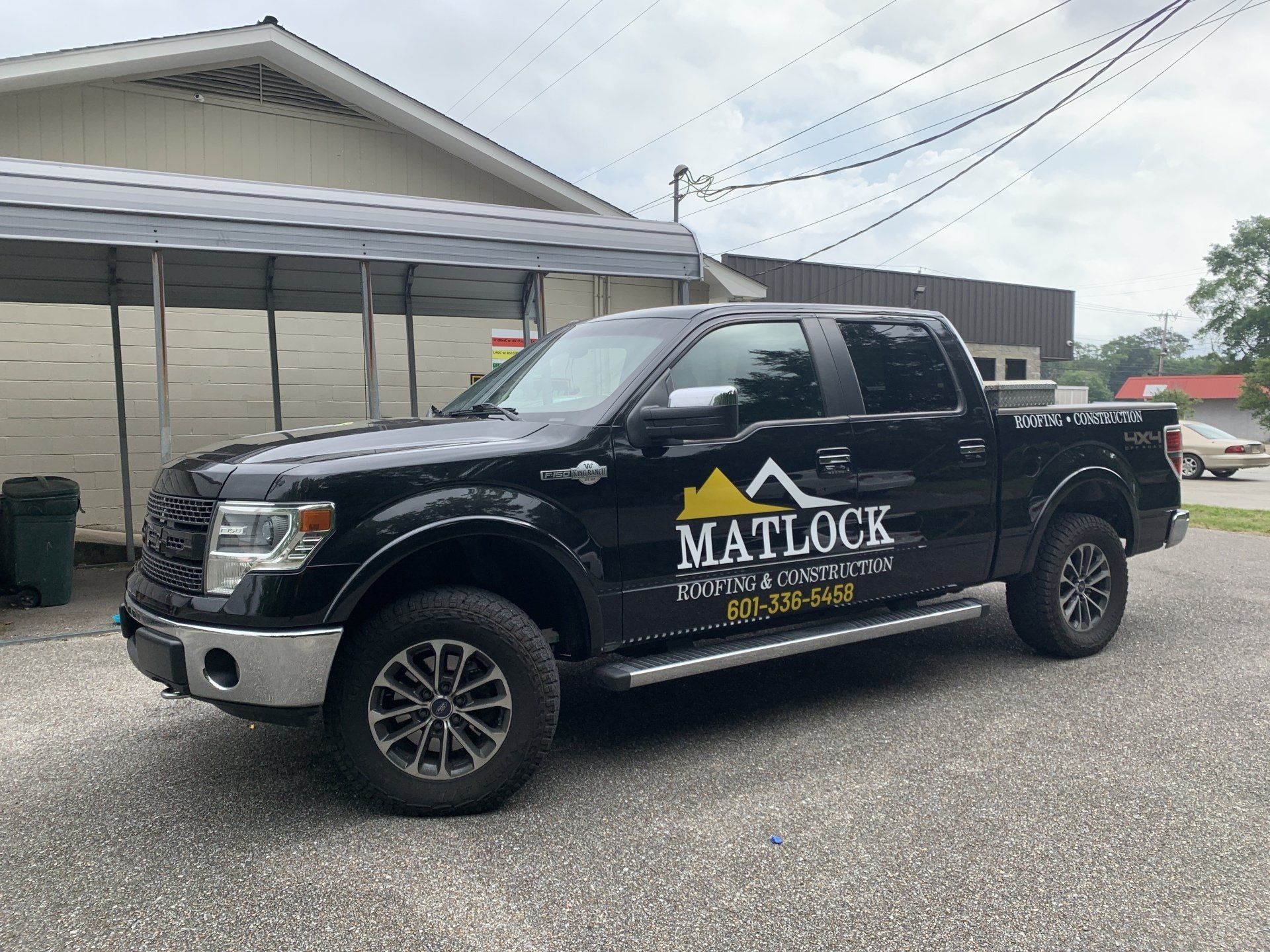 A black Ford F-150 pickup truck with 