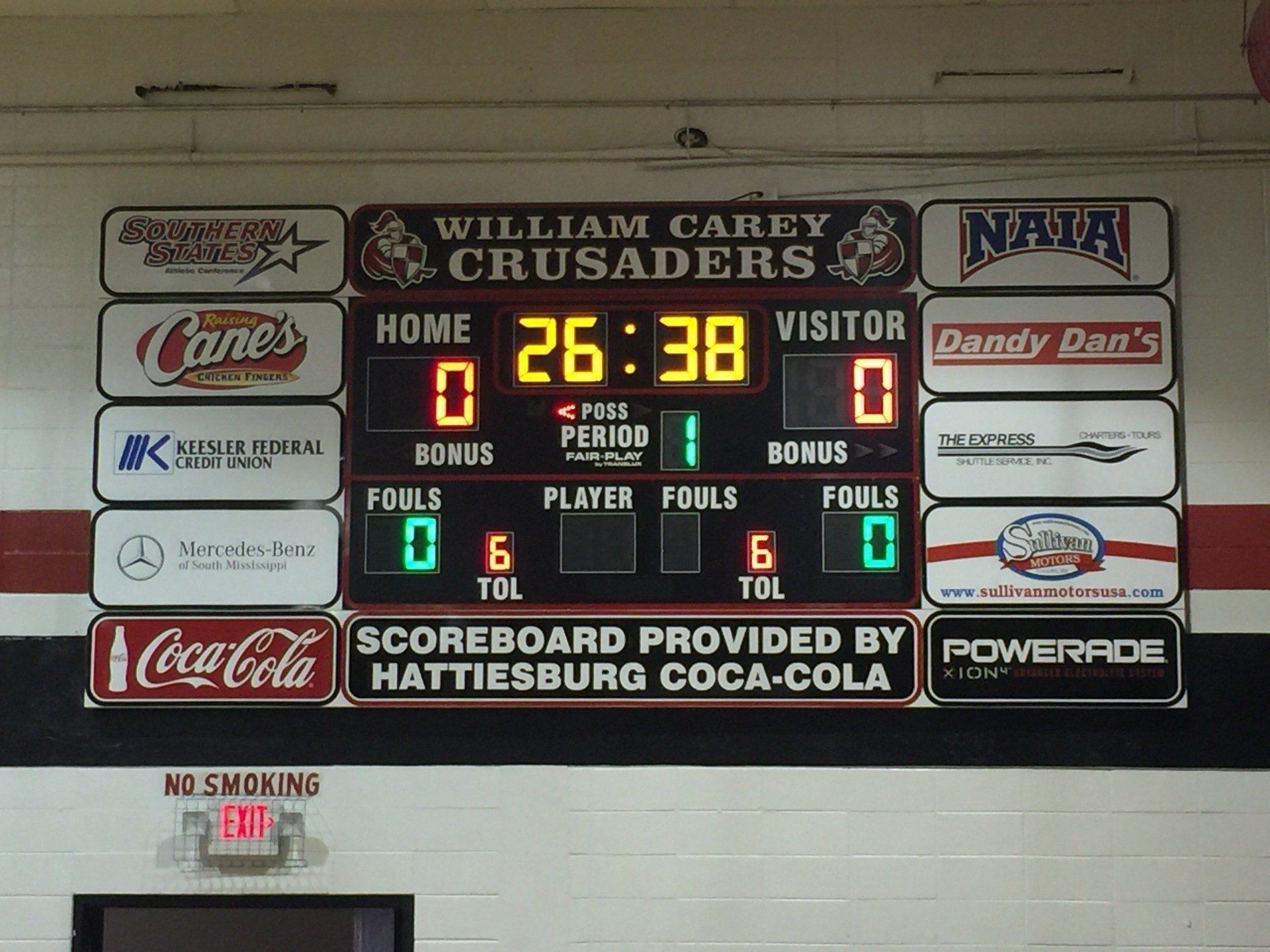 A scoreboard for William Carey University Crusaders basketball showing a 0-0 tie in the first period.