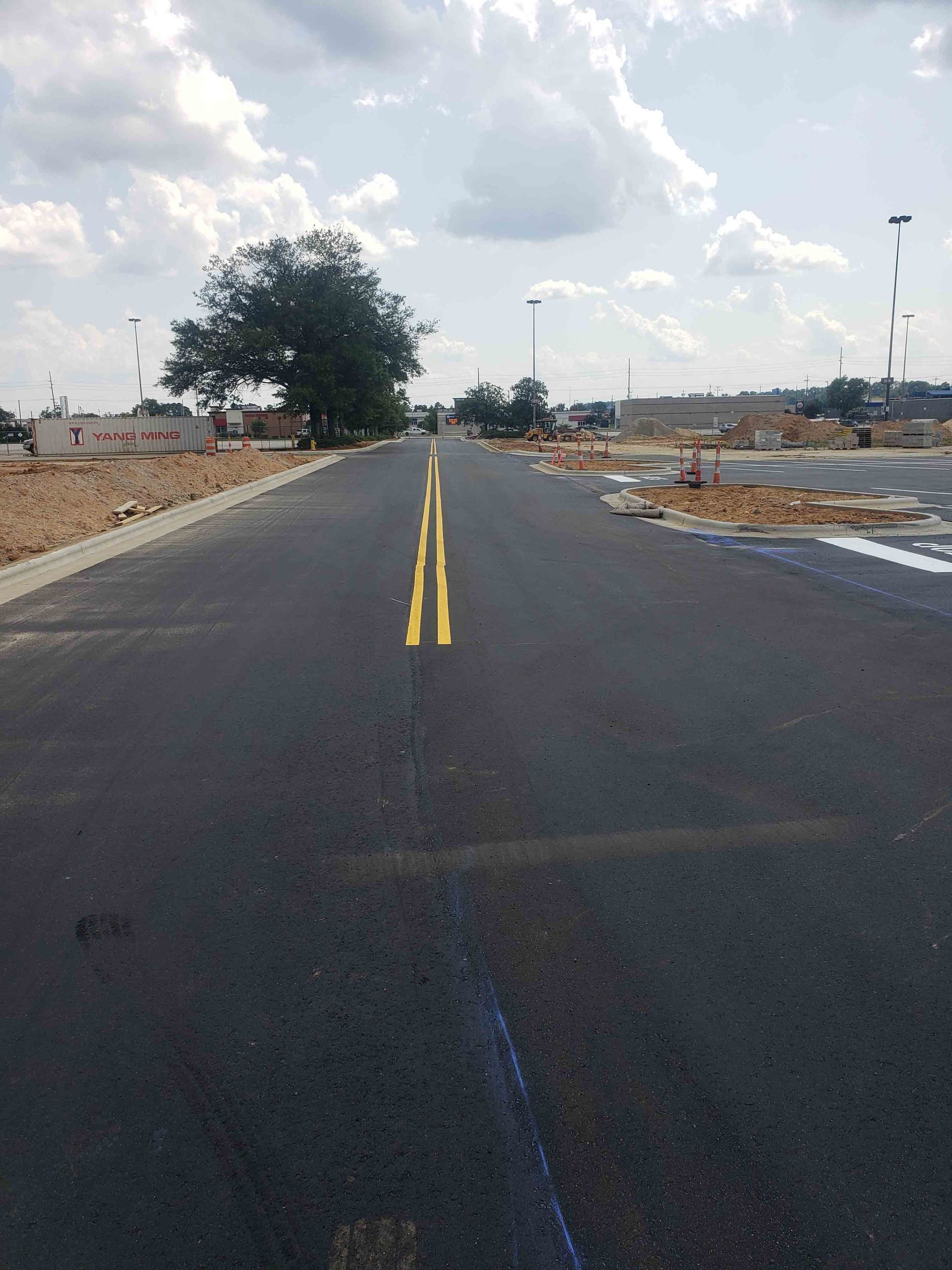 A road with two yellow lines on the middle of it