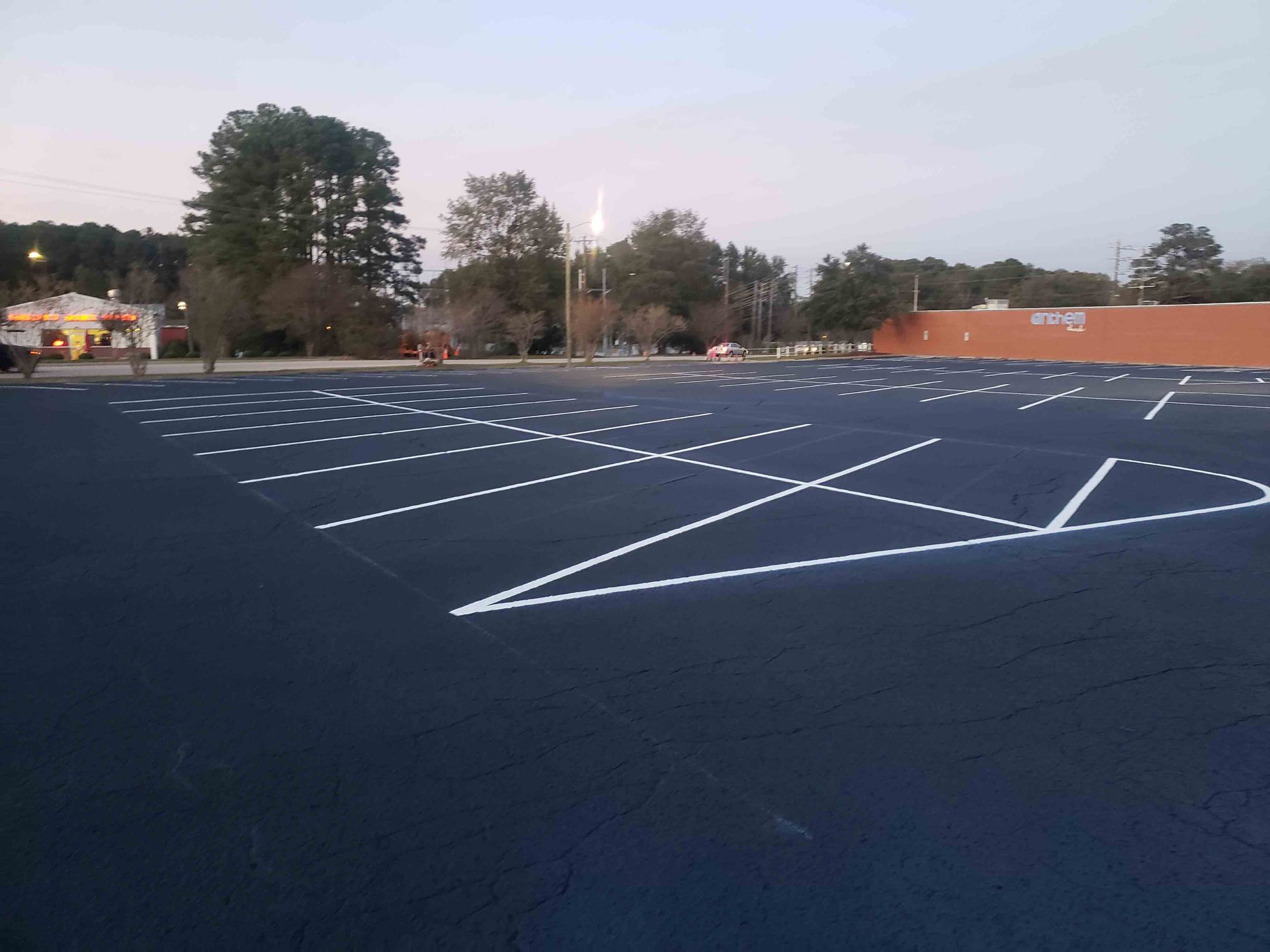 An empty parking lot with white lines on it