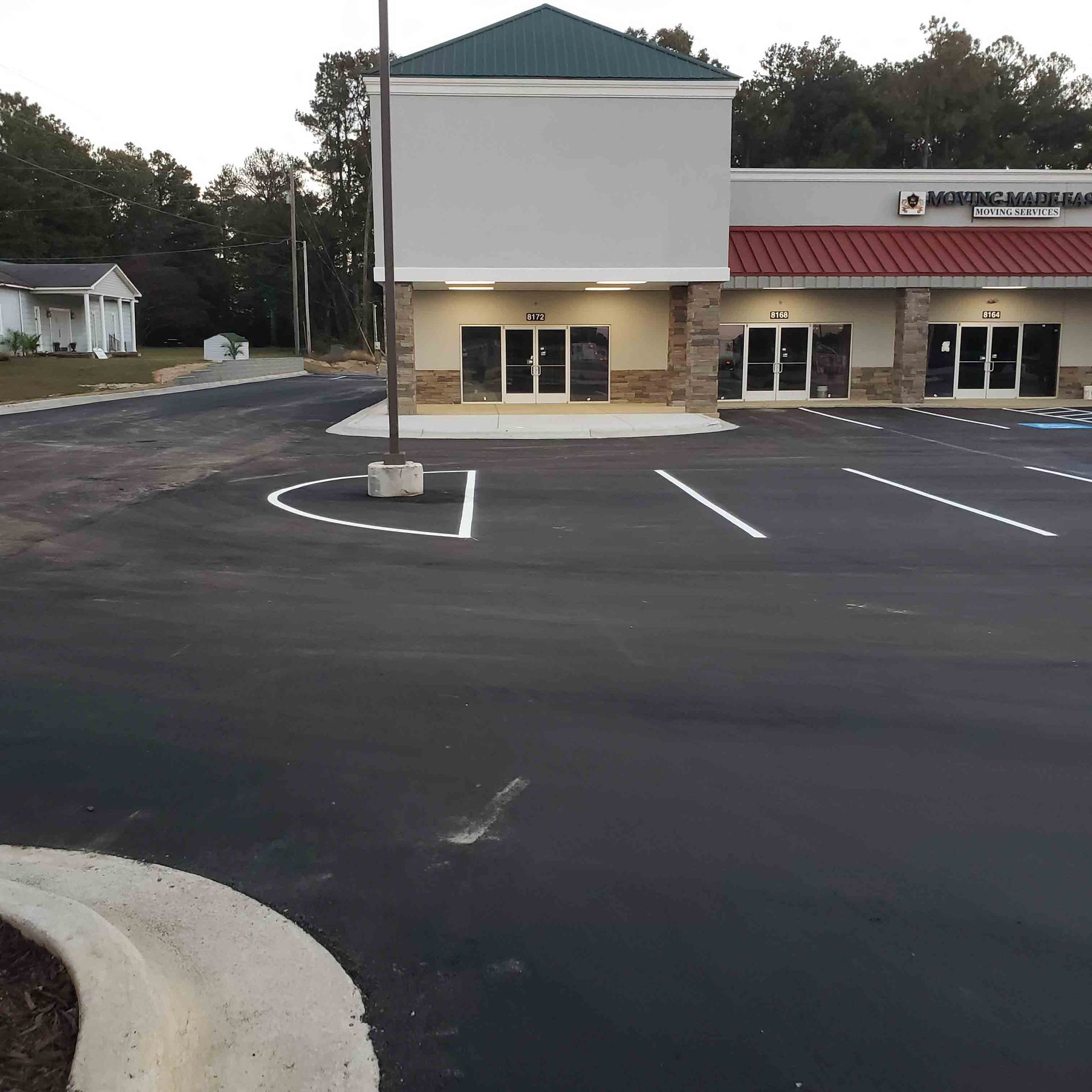 A building with a handicapped parking spot in front of it