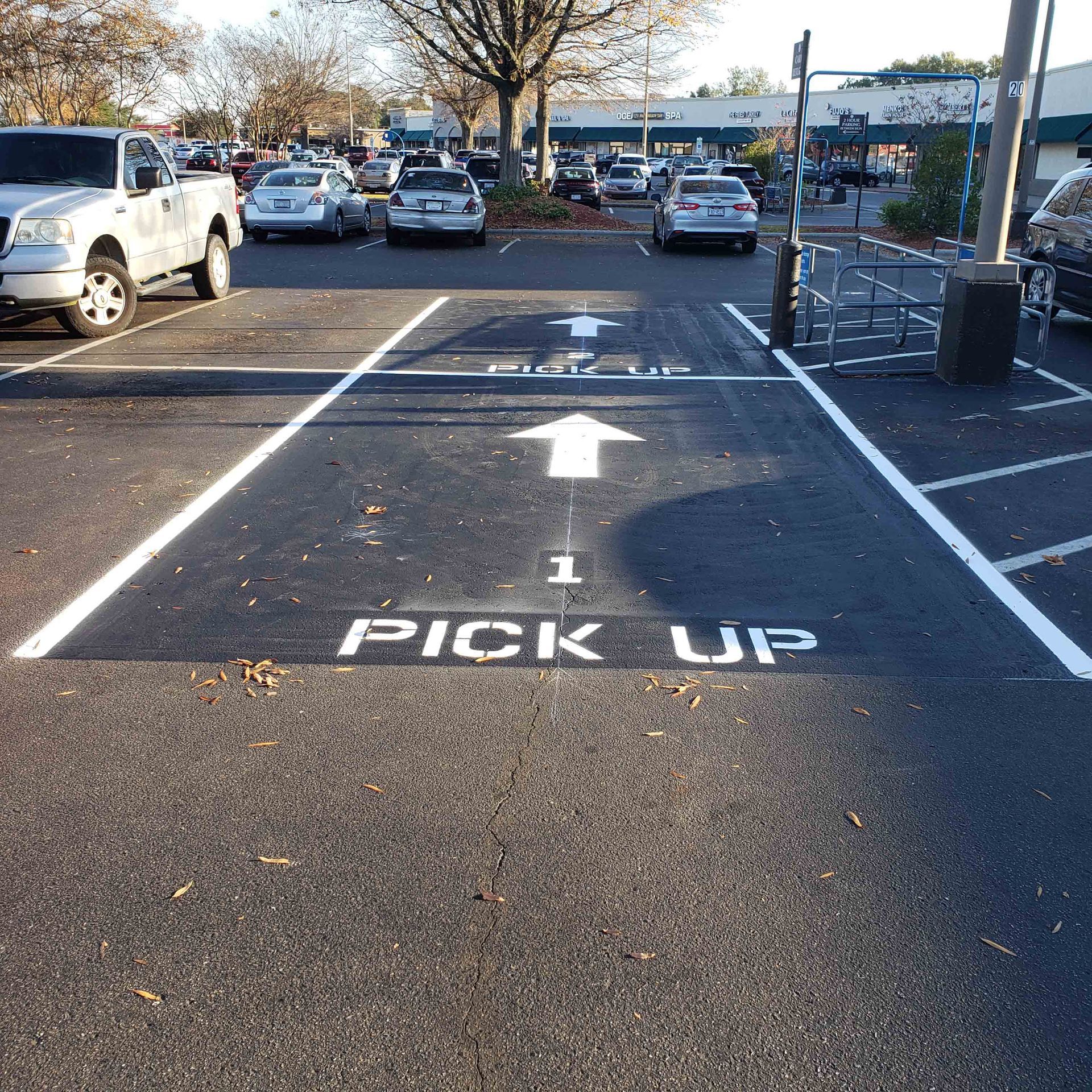 A parking lot with a sign that says pick up