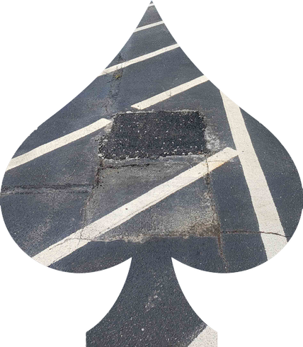 A spade shaped hole in a parking lot