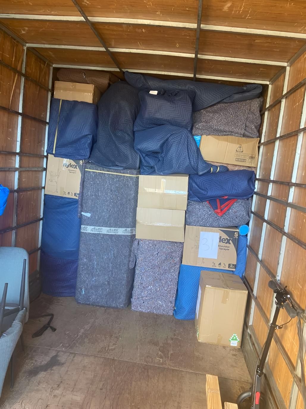 The Inside of a Moving Truck Filled With Boxes and Blankets — Roderick Removals & Van Lines In Townsville, QLD