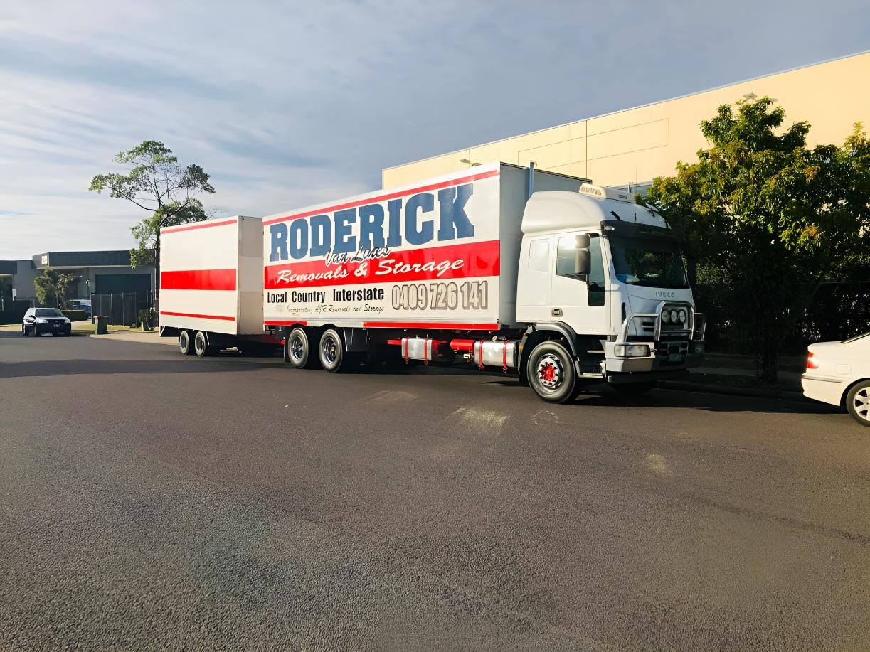 A Truck on the  Side is Parked in a Parking Lot — Roderick Removals & Van Lines In Gladstone Central, QLD