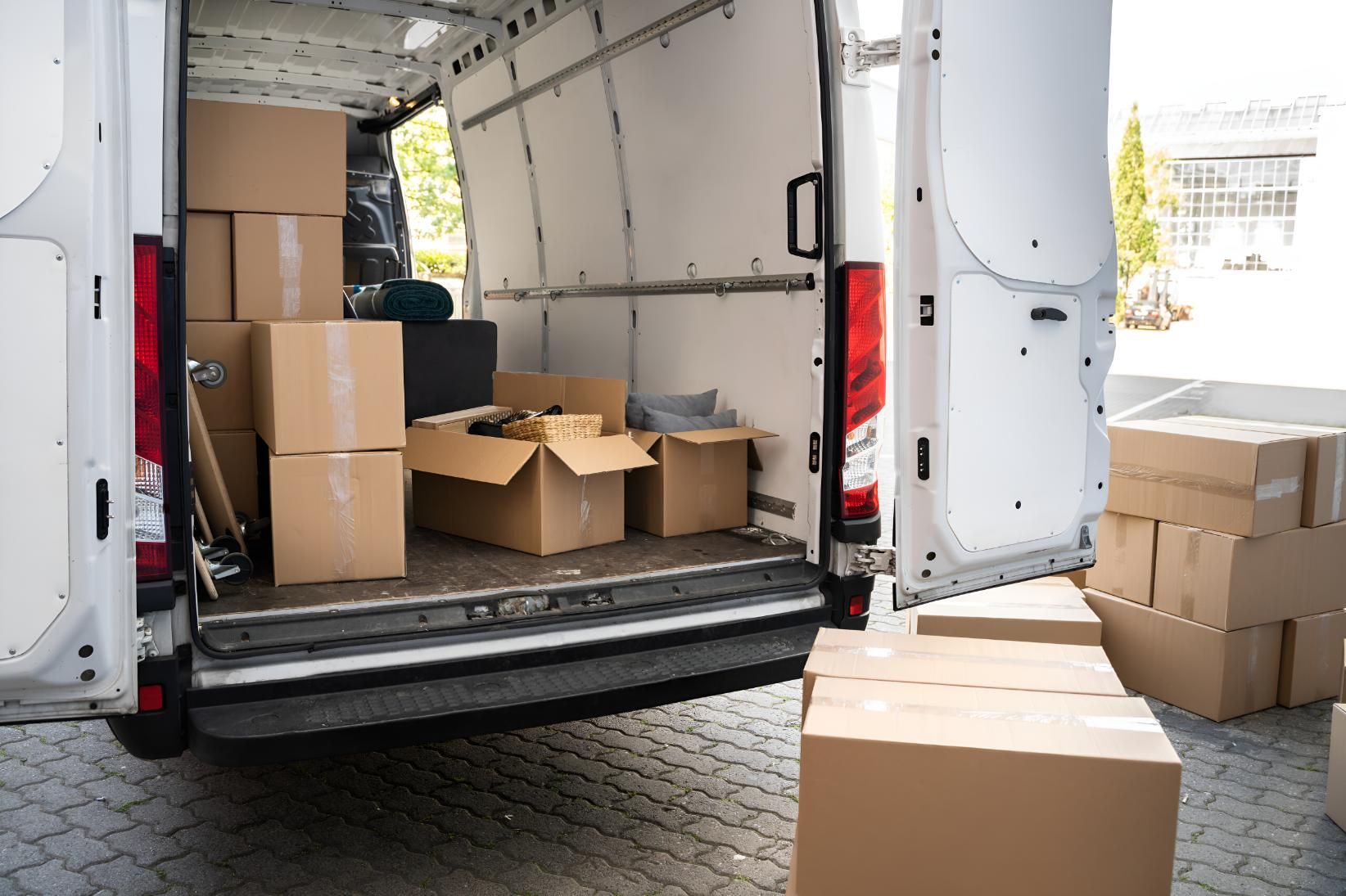 The Back of a Delivery Van is Filled With Cardboard Boxes — Roderick Removals & Van Lines In Boyne Island, QLD