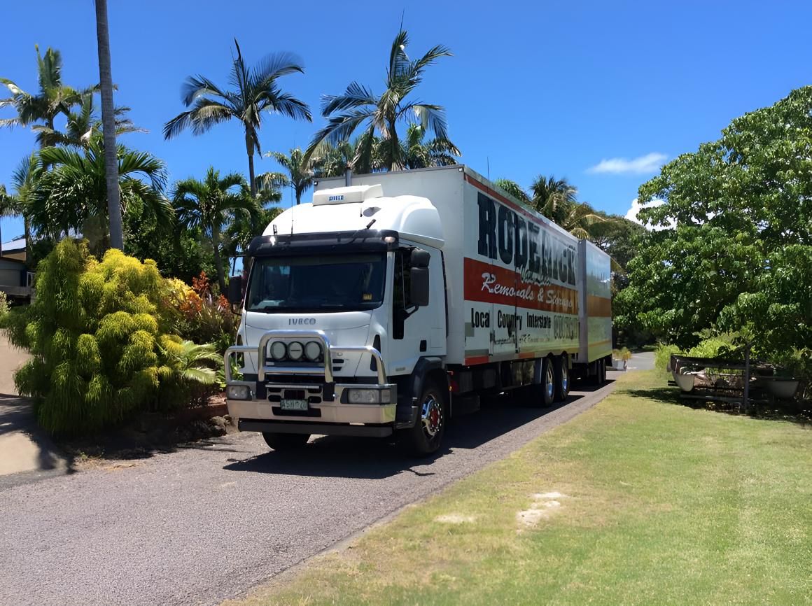 A White Truck is Parked on the Side of the Road — Roderick Removals & Van Lines In Gold Coast, NSW