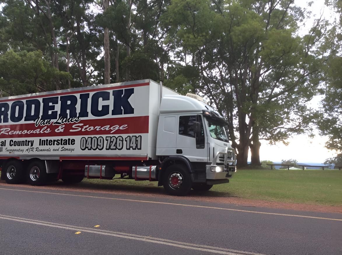 A Roderick Truck is Parked on the Side of the Road — Roderick Removals & Van Lines In Tannum Sands, QLD
