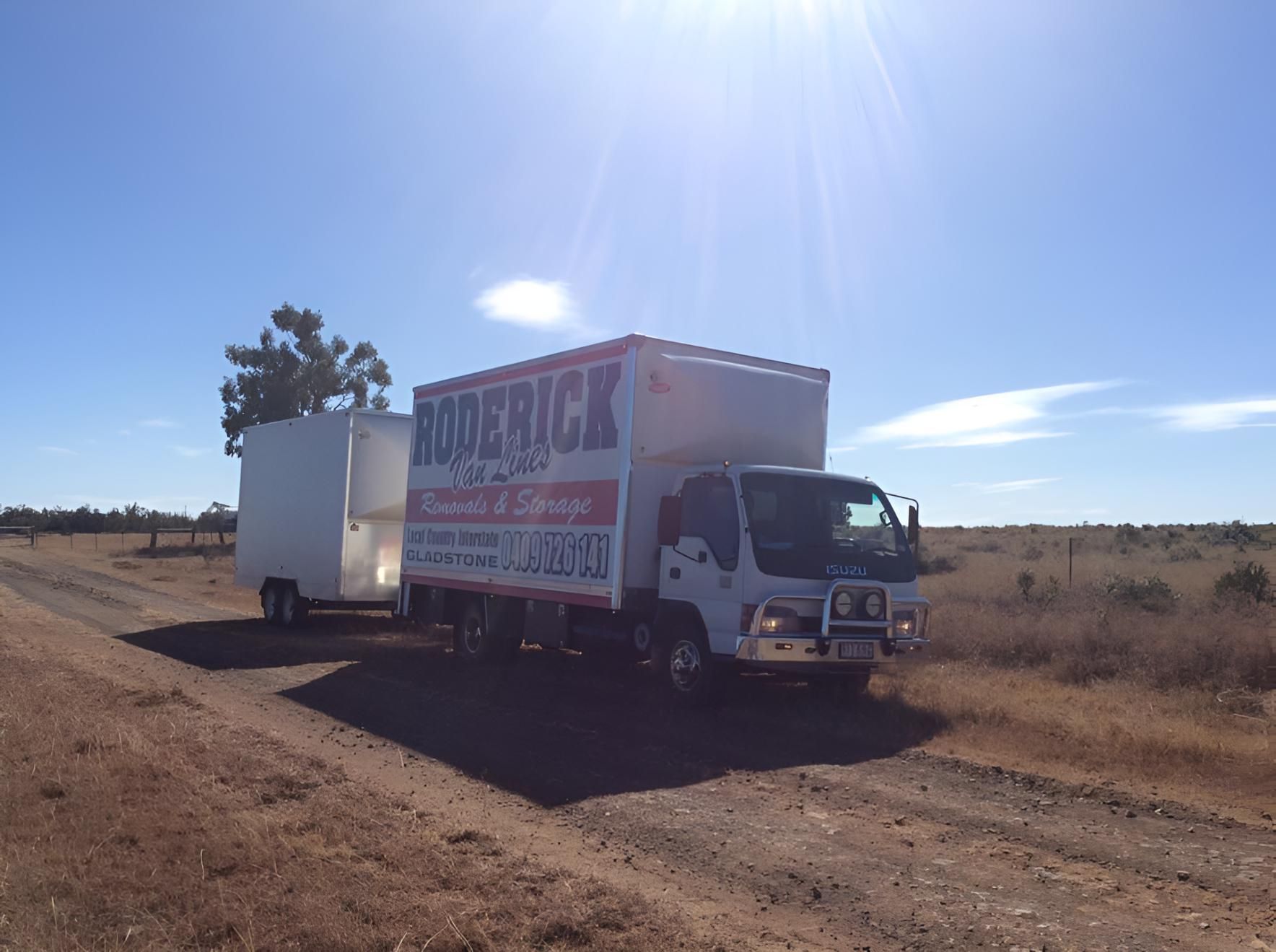 A Roderick Truck is Parked on the Side of a Dirt Road — Roderick Removals & Van Lines In Mackay, QLD