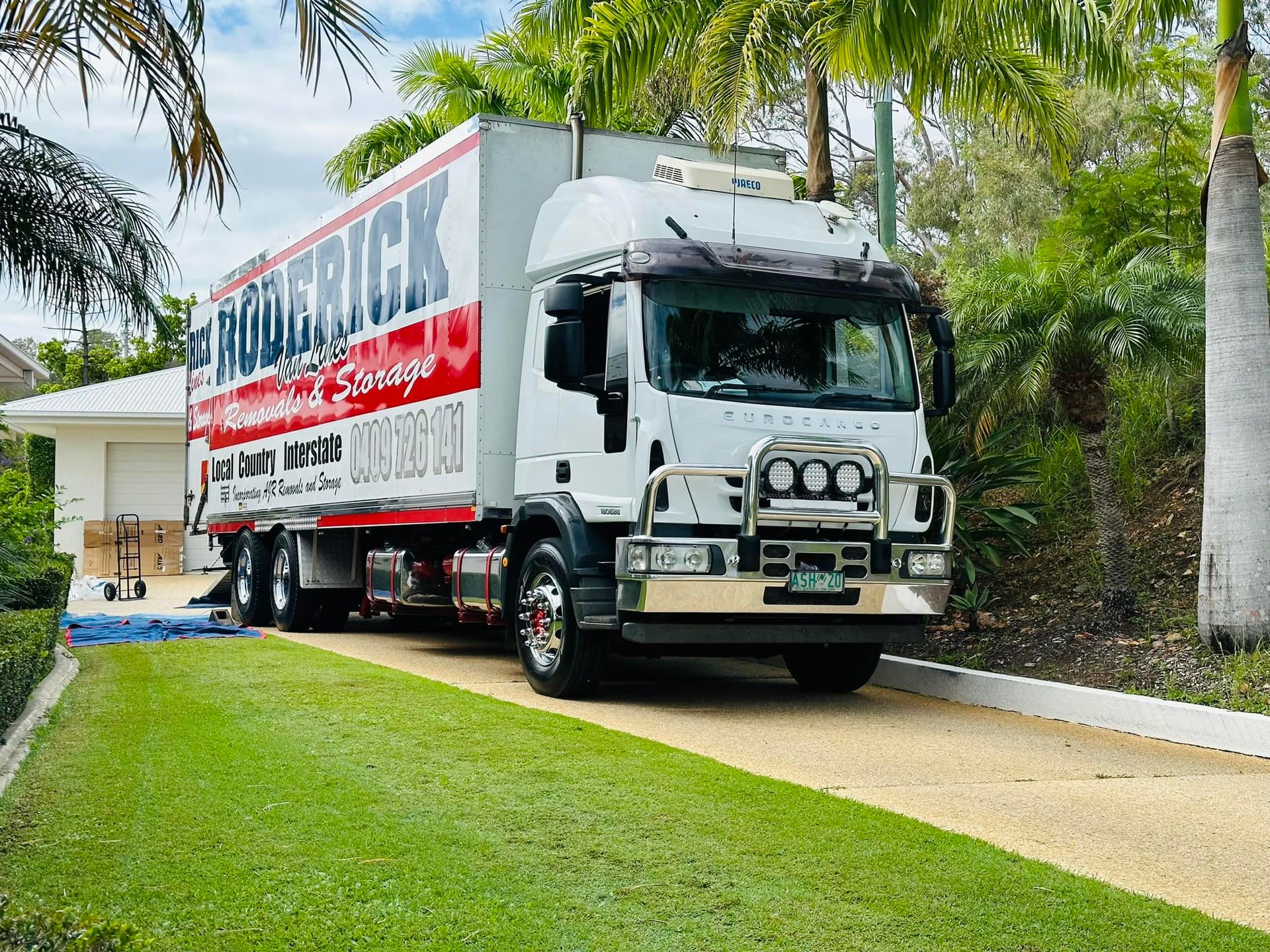 The inside of a moving truck filled with boxes and blankets — Roderick Removals & Van Lines In Gold Coast, NSW