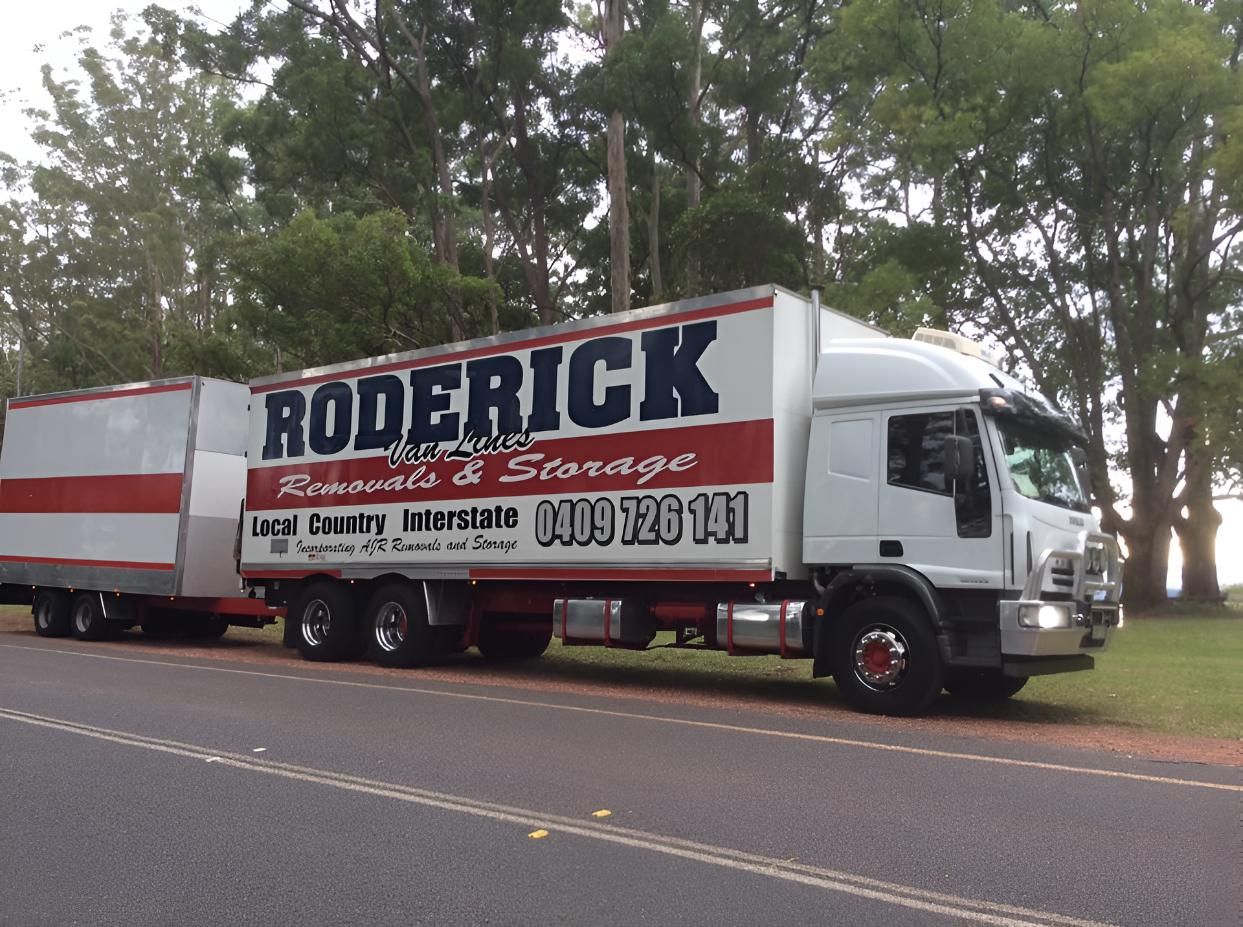 A Roderick Truck is Parked on the Side of the Road — Roderick Removals & Van Lines In Boyne Island, QLD