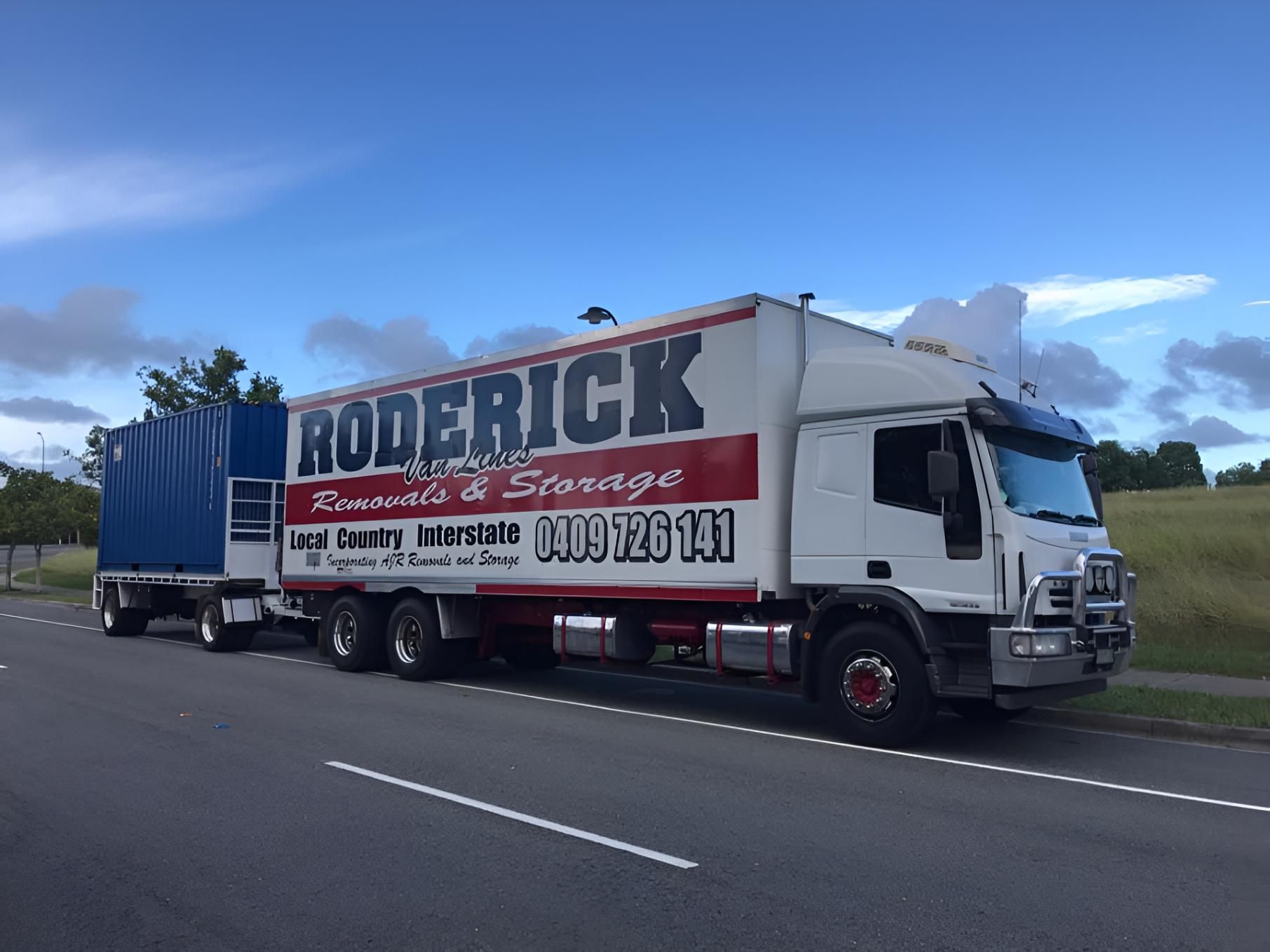 A Roderick Truck is Parked on the Side of the Road — Roderick Removals & Van Lines In Brisbane, QLD
