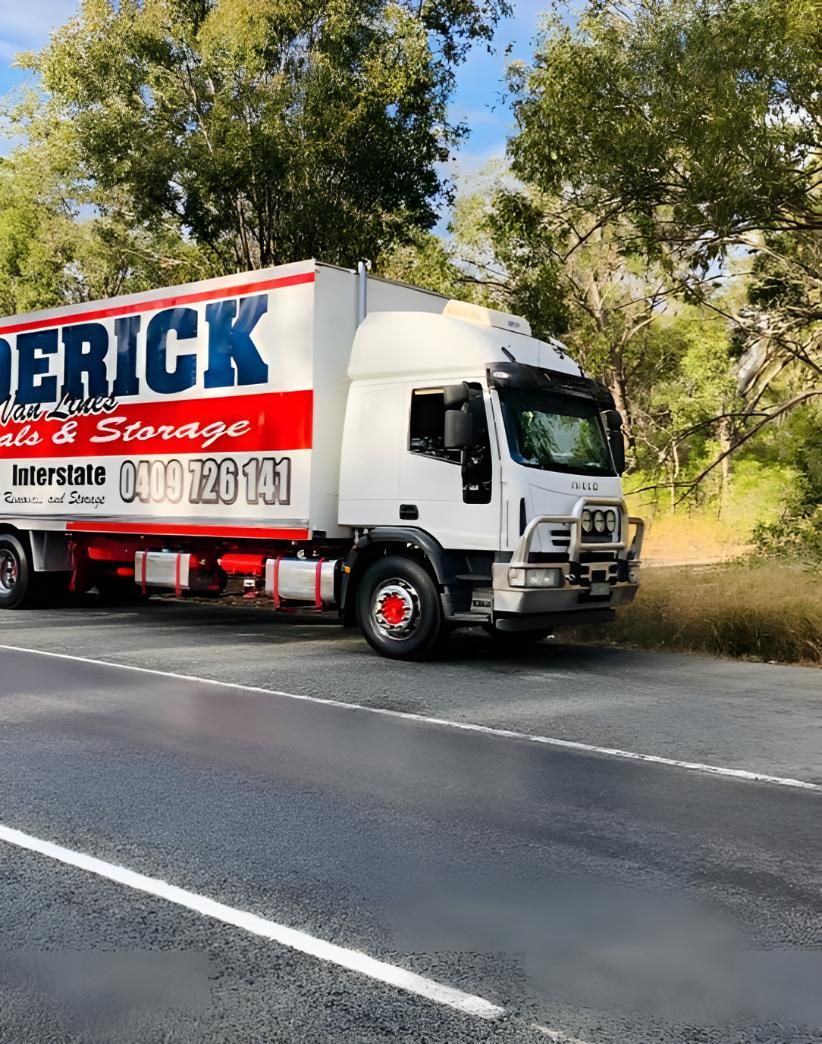 A White Truck is Parked on the Side of the Road — Roderick Removals & Van Lines In Gold Coast, NSW