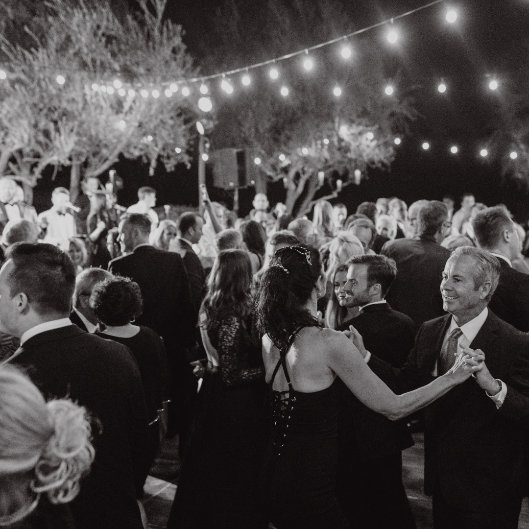 wedding guests dancing in black and white