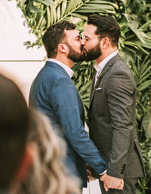 two grooms first kiss
