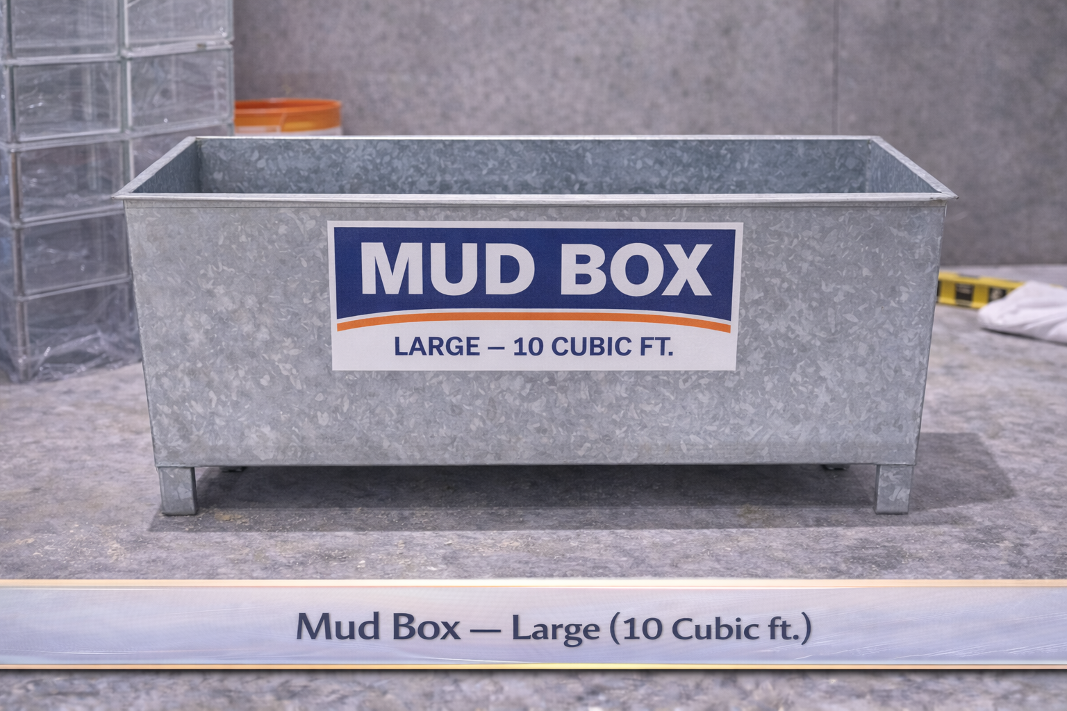 Gray metal mud box labeled “MUD BOX” in a garage or workshop setting