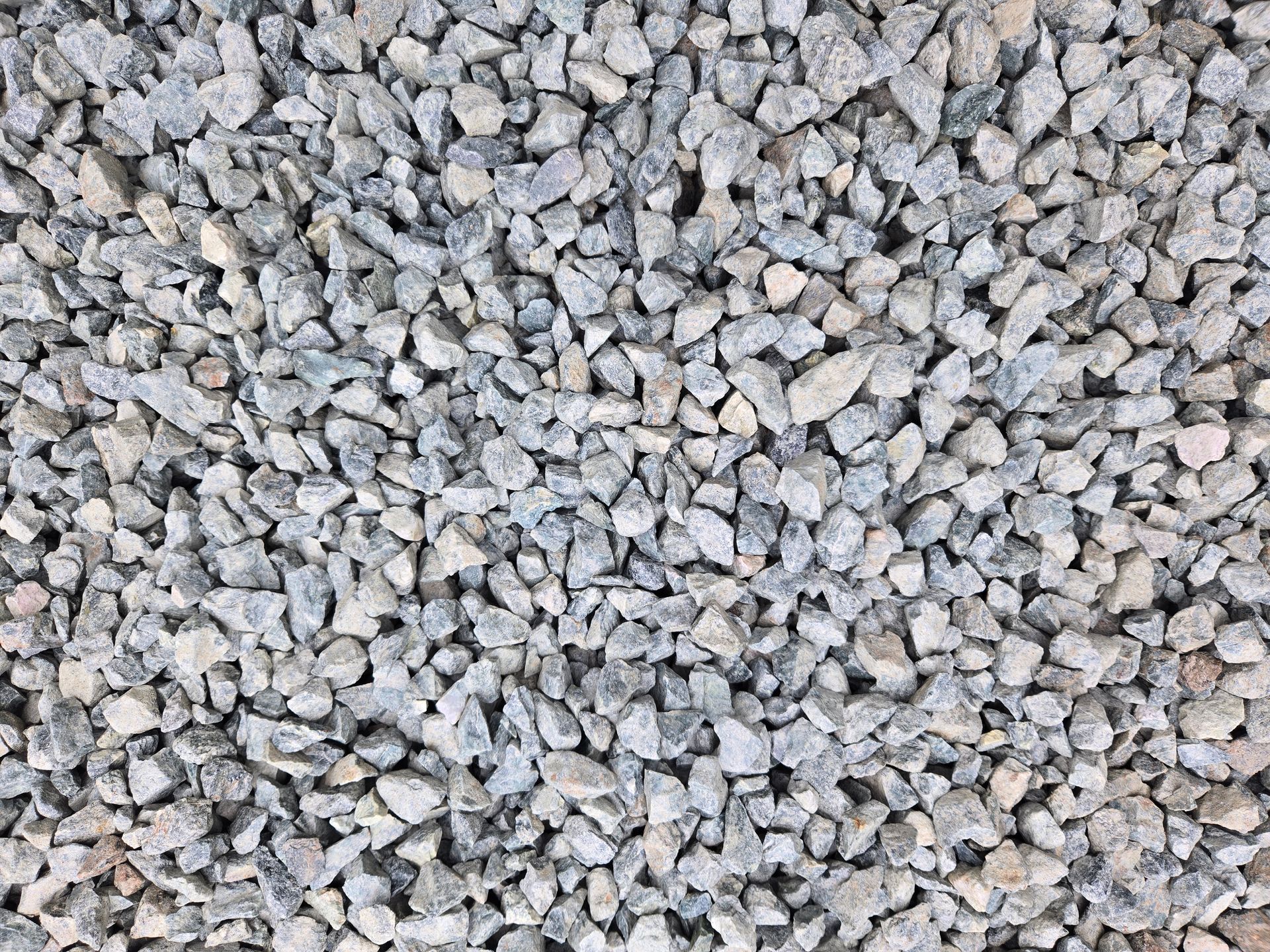 Close-up of gray gravel stones covering the ground