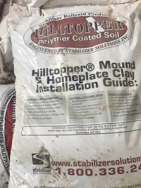 White bag of Hilltopper polymer-coated soil with installation guide text and website logo.