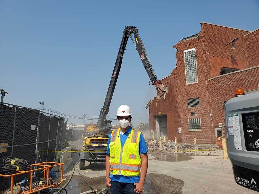 A demolition contractor outside a demo site.