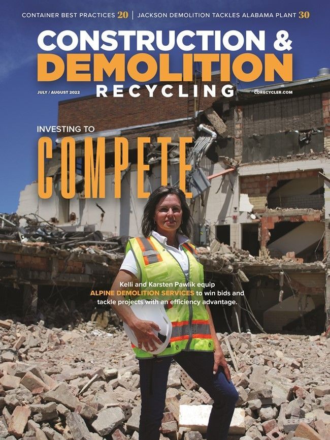 A woman is on the cover of a construction and demolition recycling magazine
