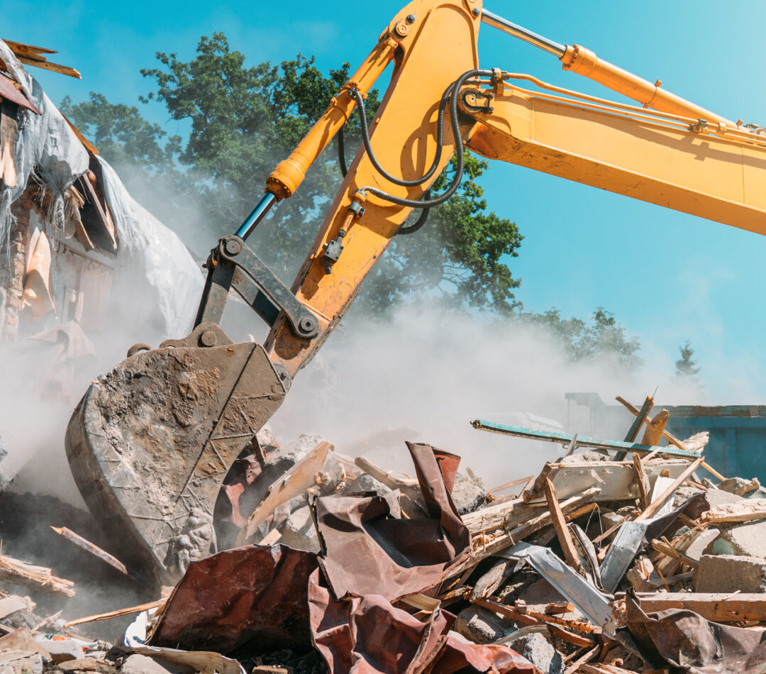 An excavator being operated by a commercial demolition contractor