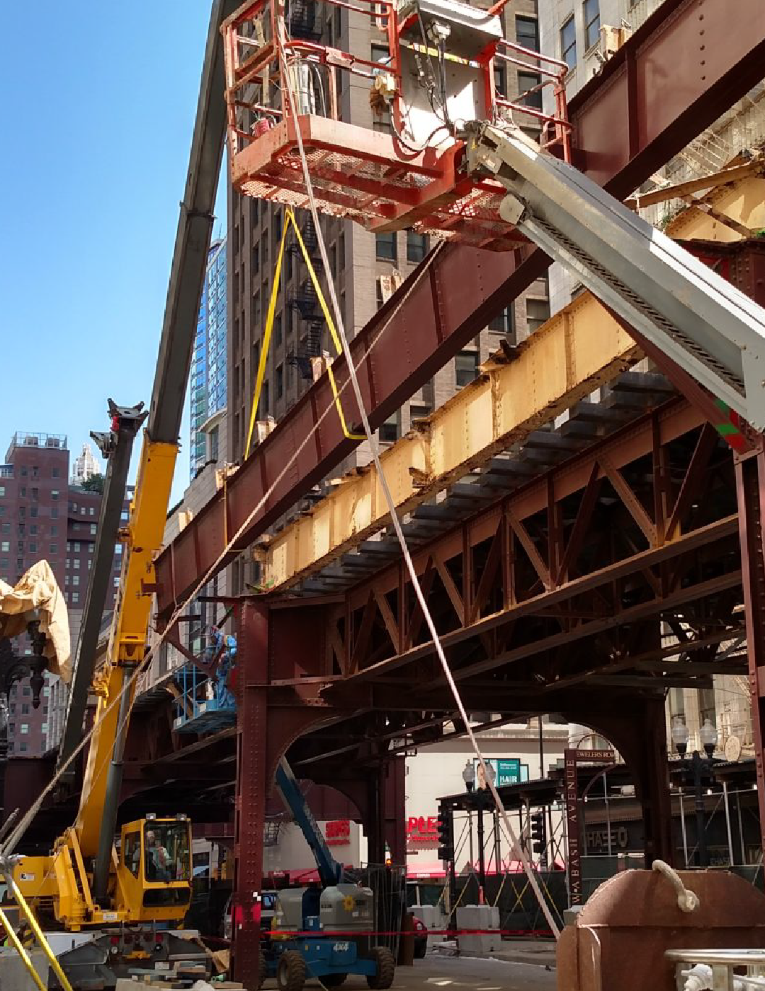 A construction site with a crane and a ladder