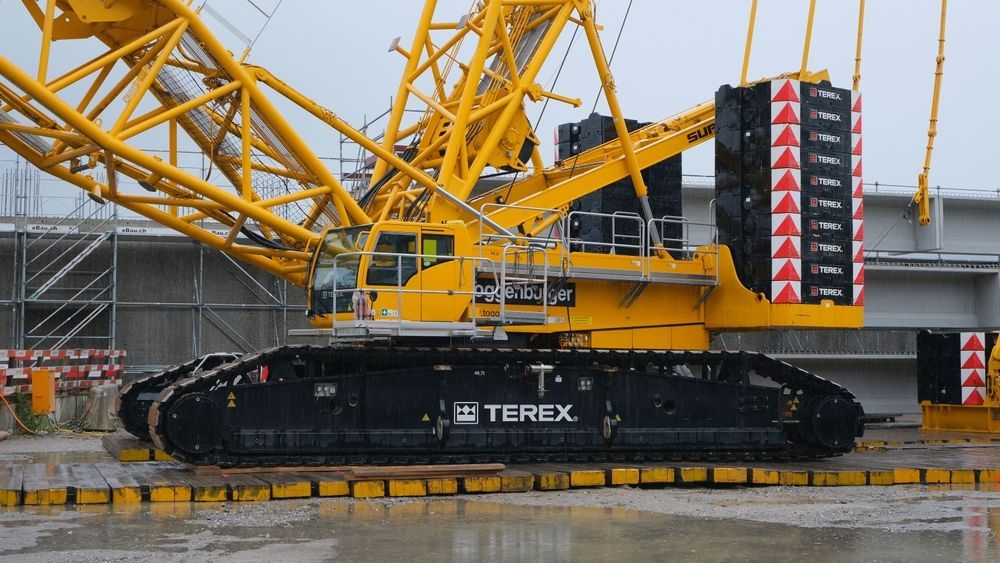 A large yellow crane with the word terex on it
