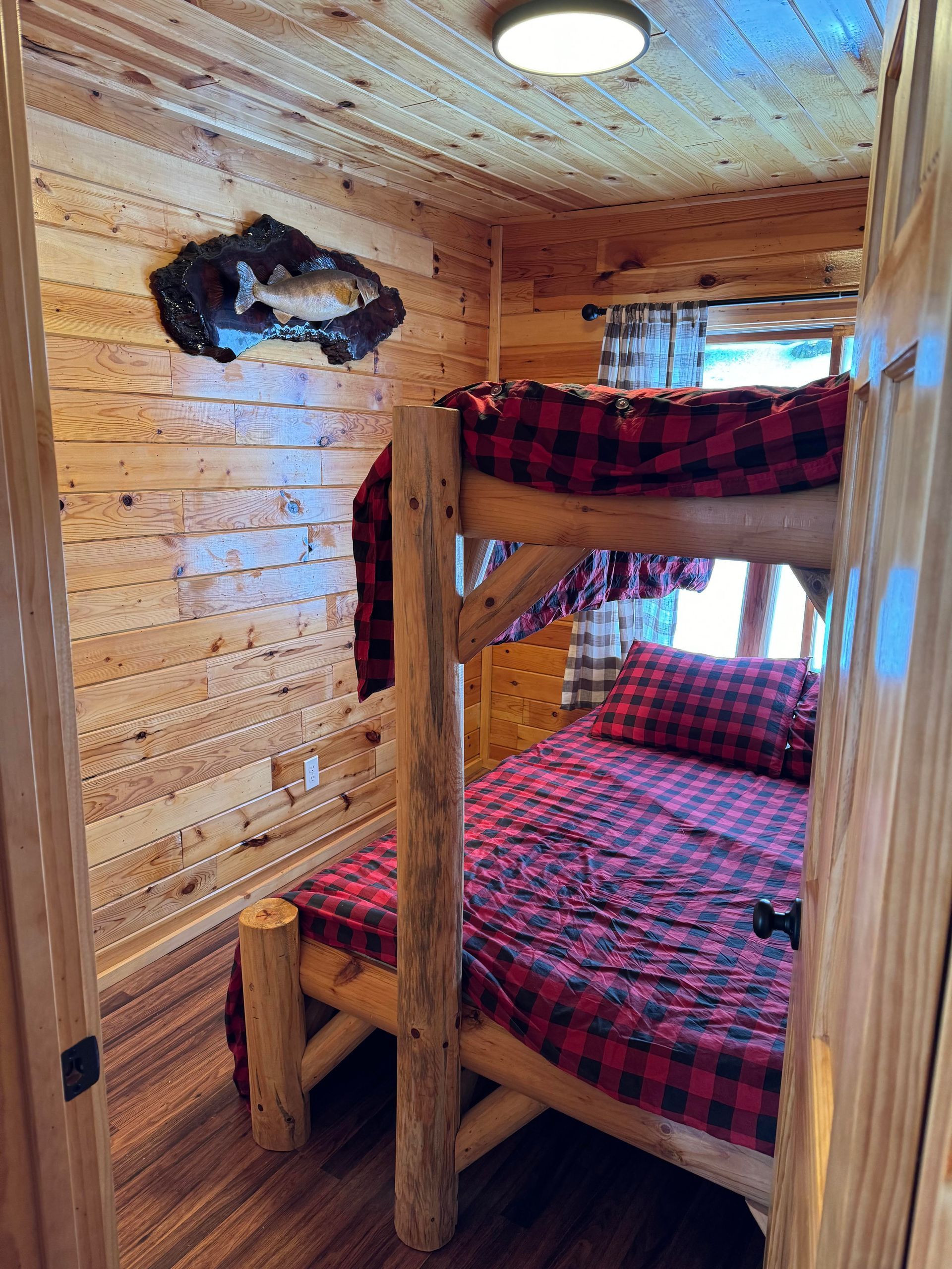 there is a bunk bed in the corner of the room .