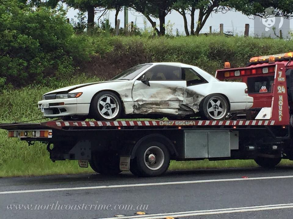 White Car Is Towed On The Back Of A Tow Truck — Alpine Towing Services in Lismore, NSW
