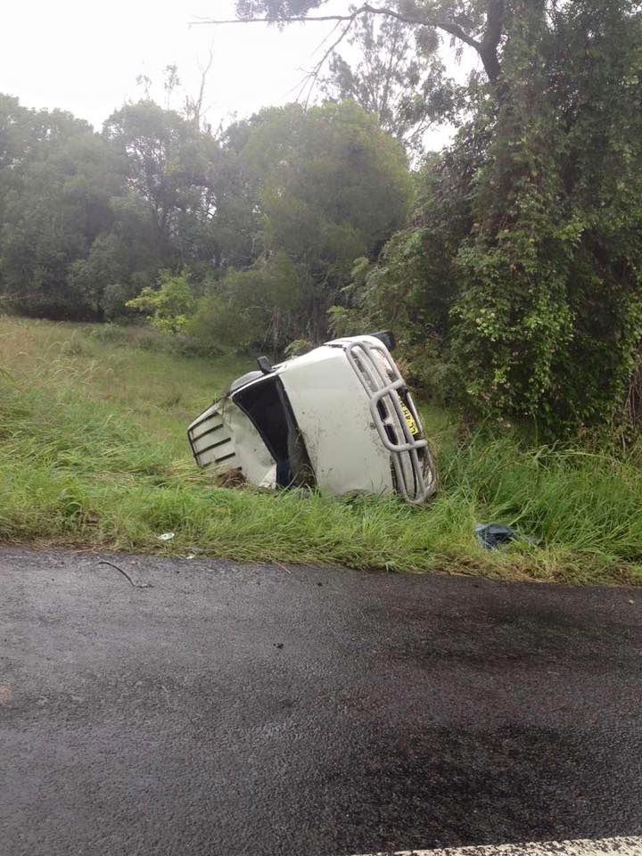 A White Van Is Turned Over on The Side of The Road — Alpine Towing Services in Lismore, NSW
