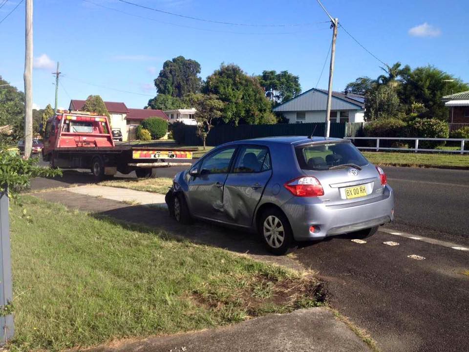 A Car Is Parked Behind The Towing Truck — Alpine Towing Services in Byron Bay, NSW