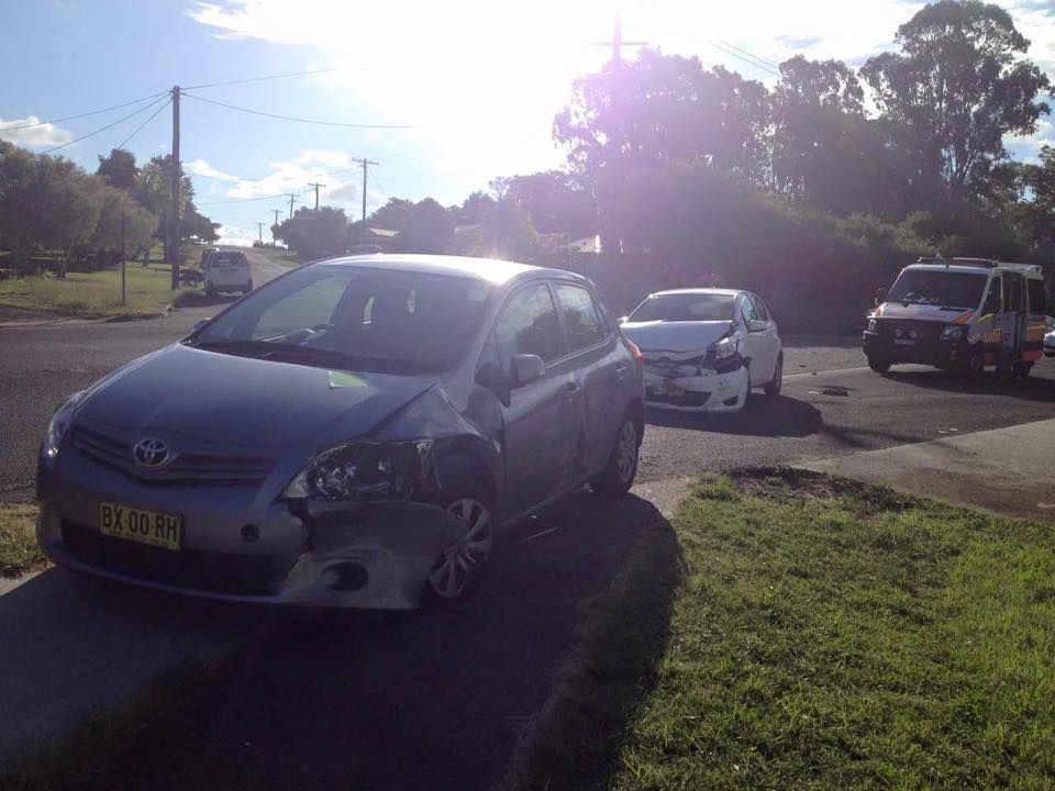 An Old Car Is Being Towed by A Tow Truck — Alpine Towing Services in Byron Bay NSW