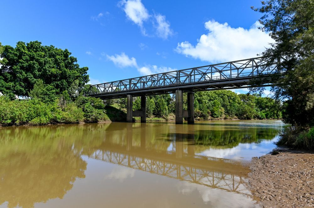 A Large Car Bridge Over River With Trees Surrounding — Alpine Towing Services in Lismore, NSW