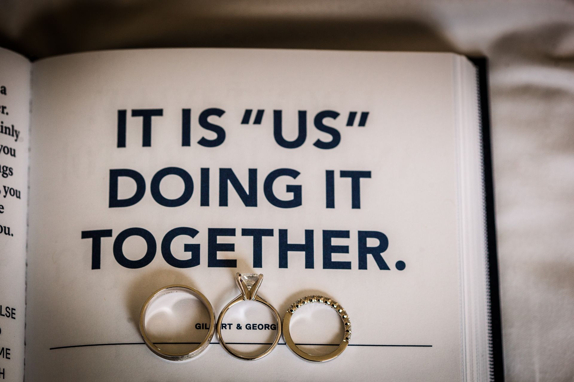 Engagement rings on a page reading, “It is ‘us’ doing it together.”
