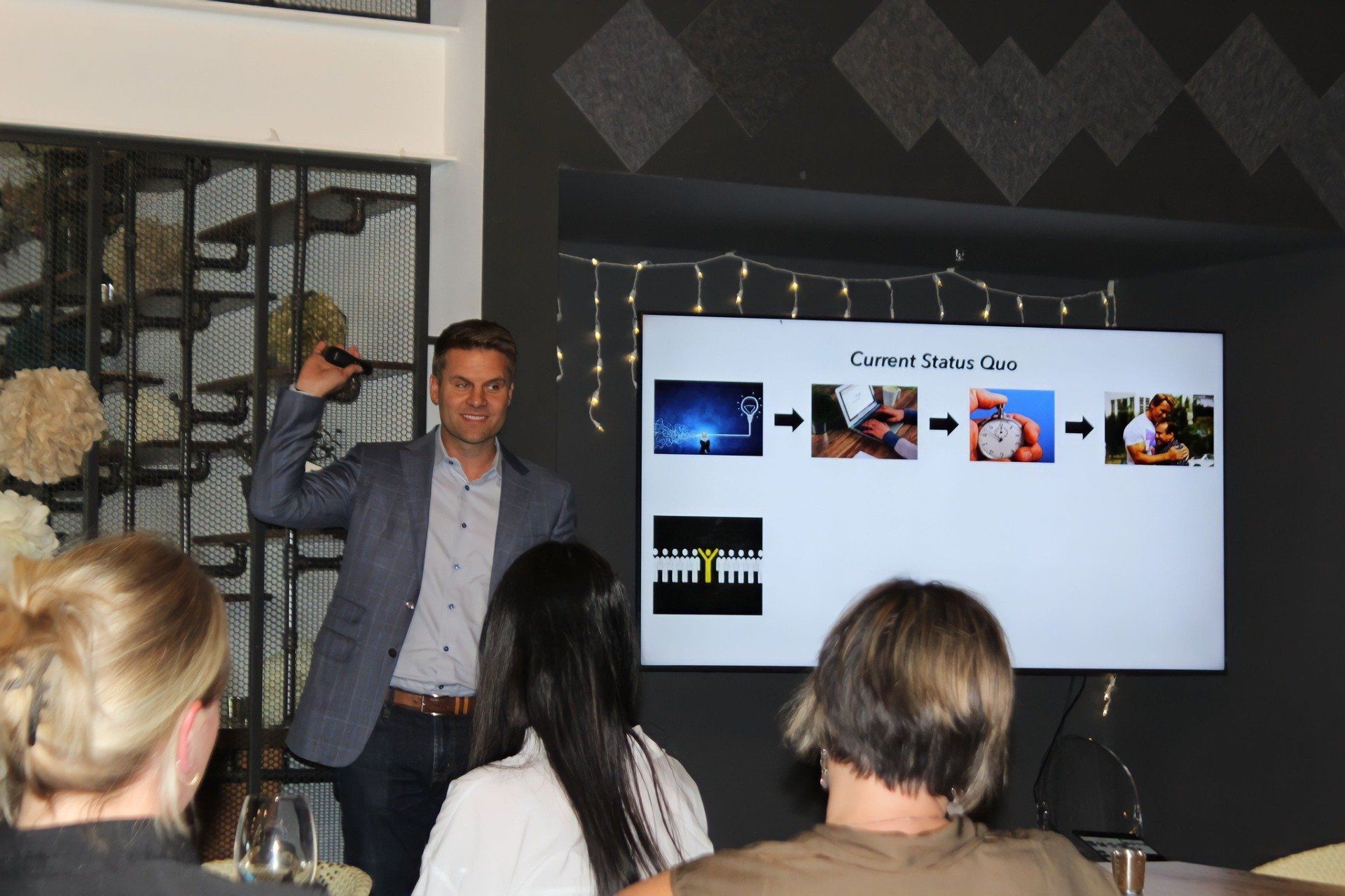 A man is giving a presentation to a group of people