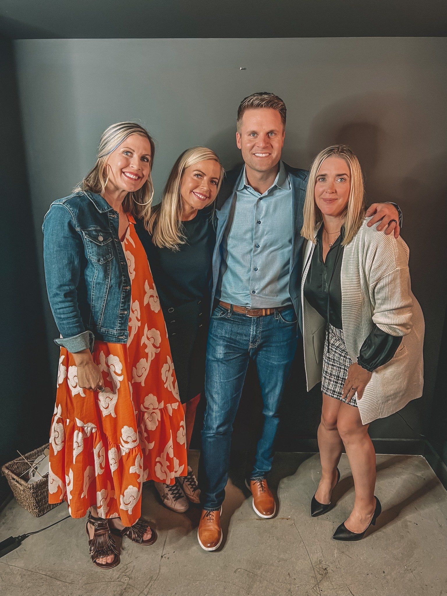 A man and three women pose for a picture together
