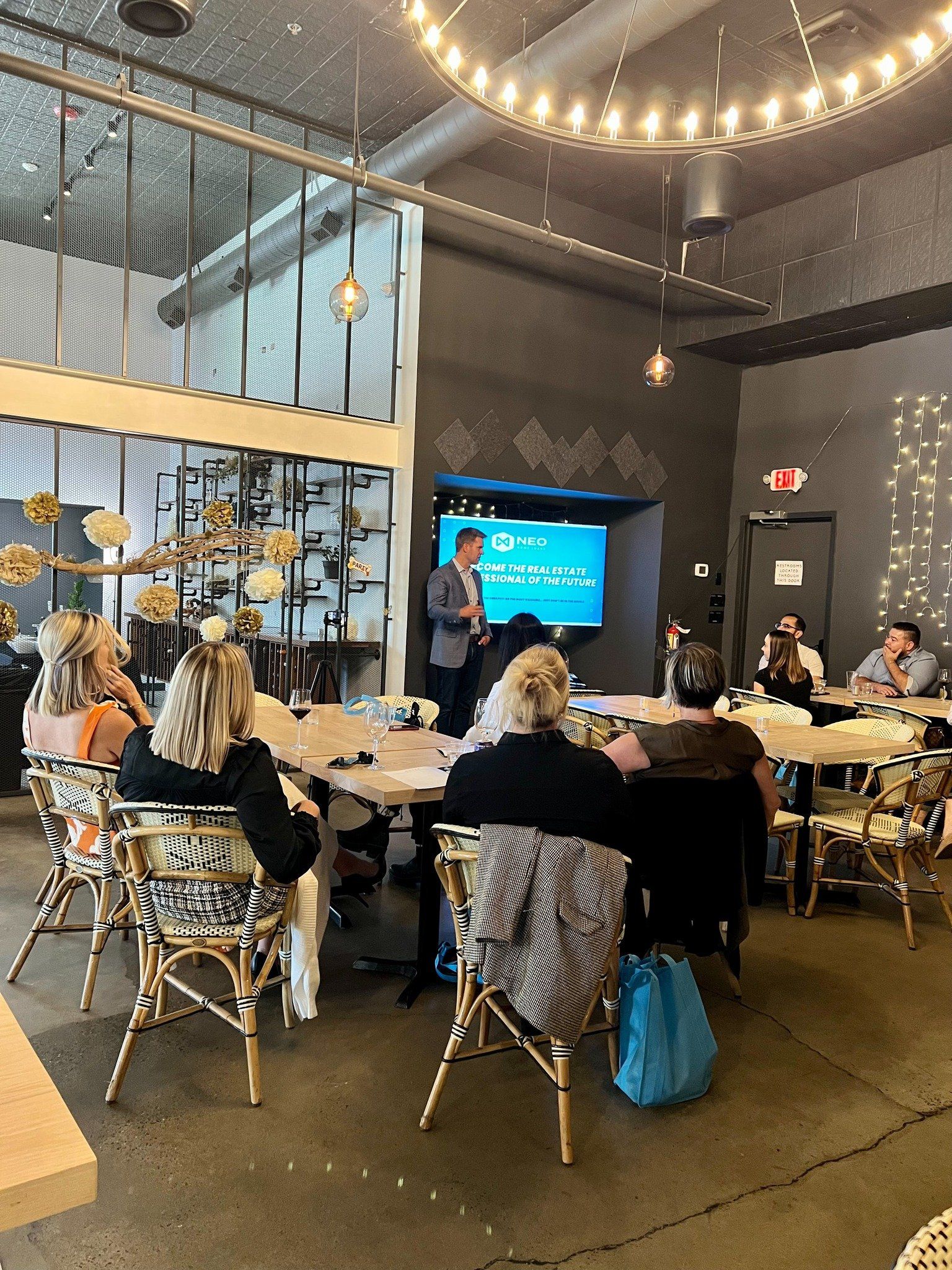 A man is giving a presentation to a group of people