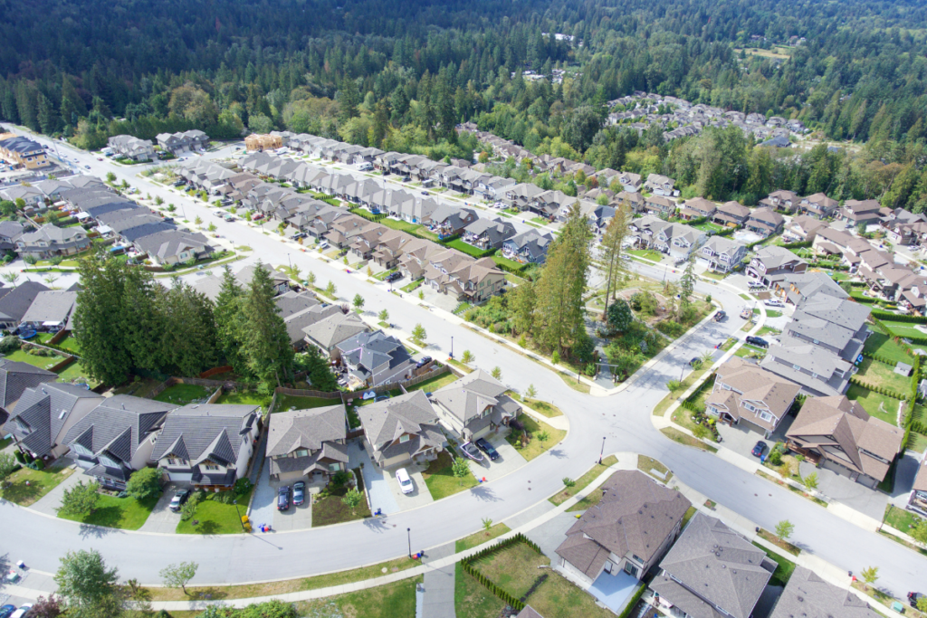 An aerial view of a residential area with lots of houses and trees