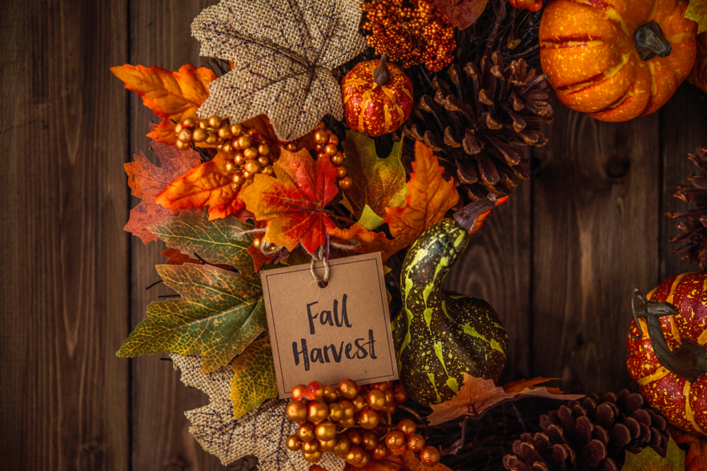 A wreath with a tag that says fall harvest