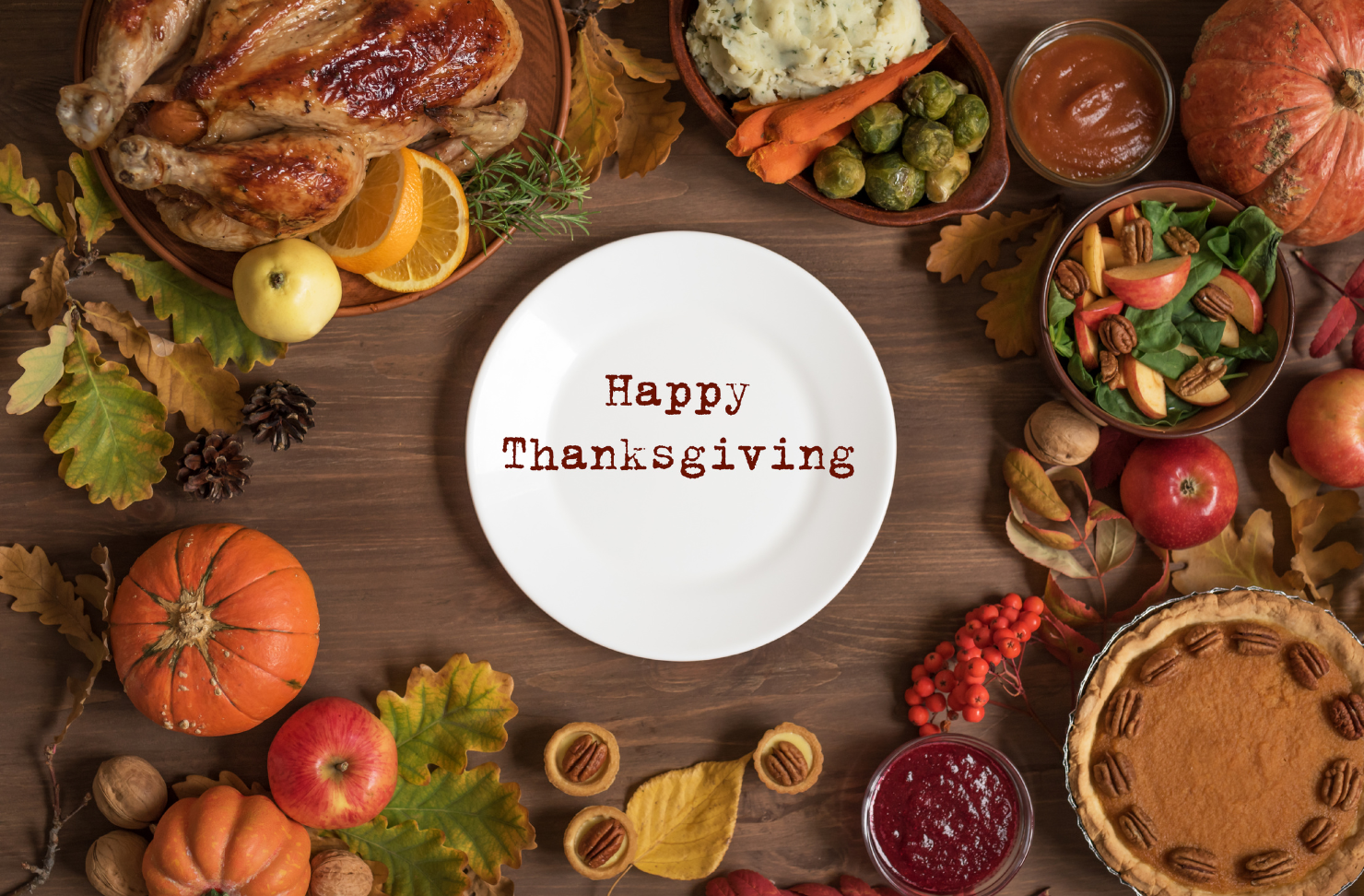 A white plate with the words happy thanksgiving written on it