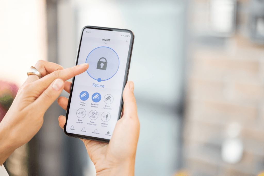 A person is holding a cell phone with a lock on the screen.