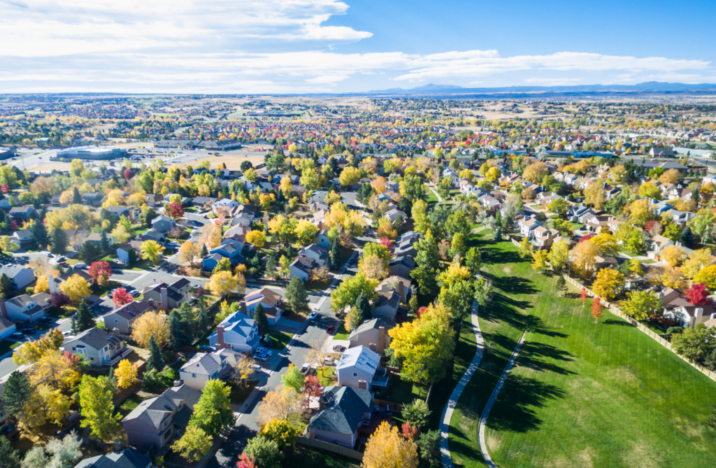 An aerial view of a residential area with lots of trees