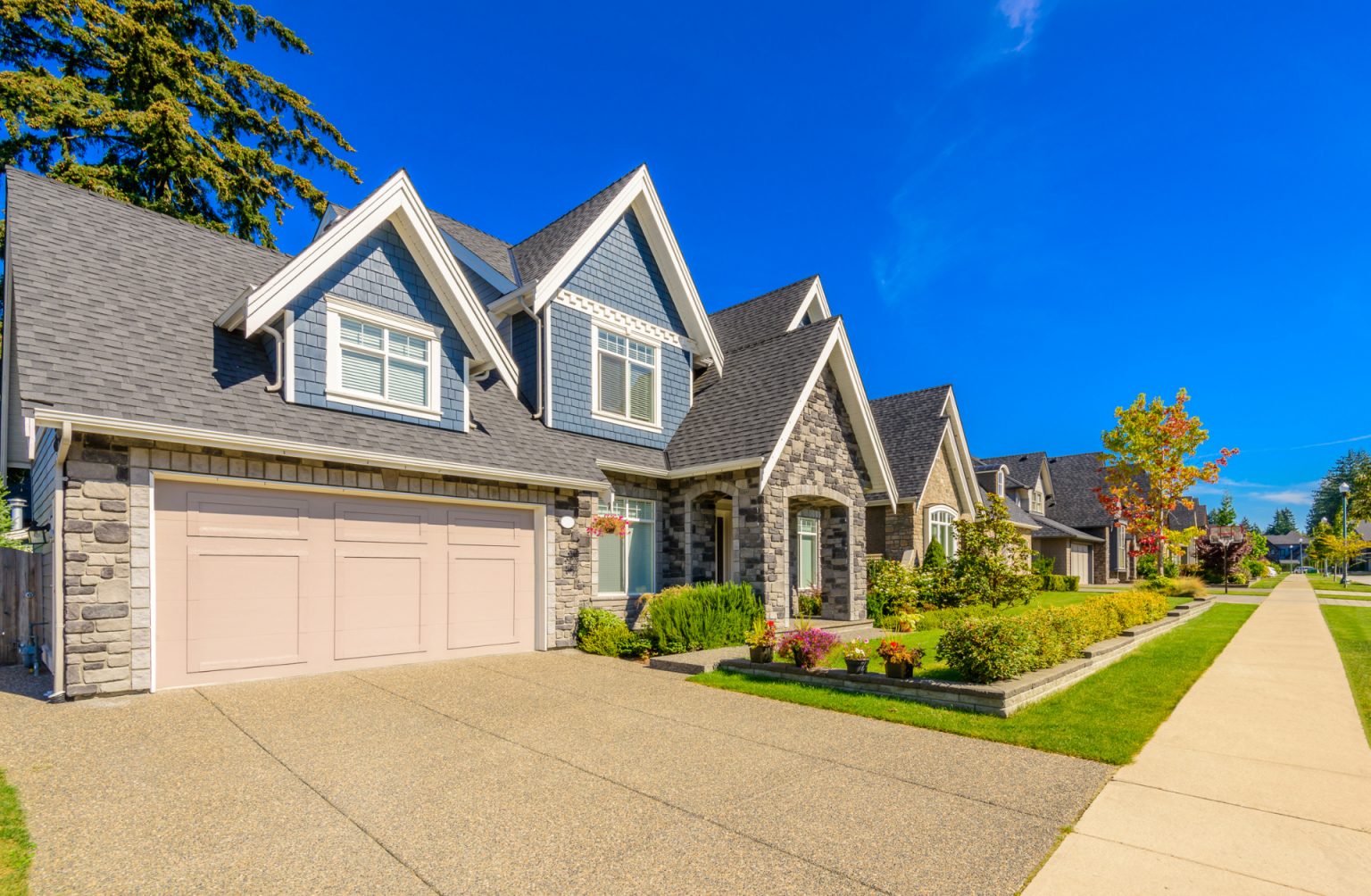 A row of houses in a residential neighborhood on a sunny day