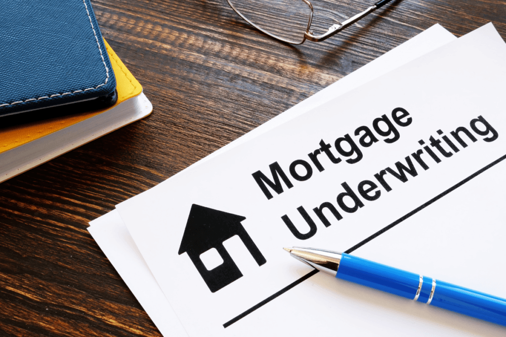 A mortgage underwriting form with a pen on it