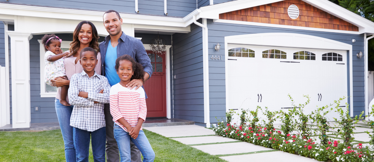 Family standing outside their new home in Winston-Salem NC