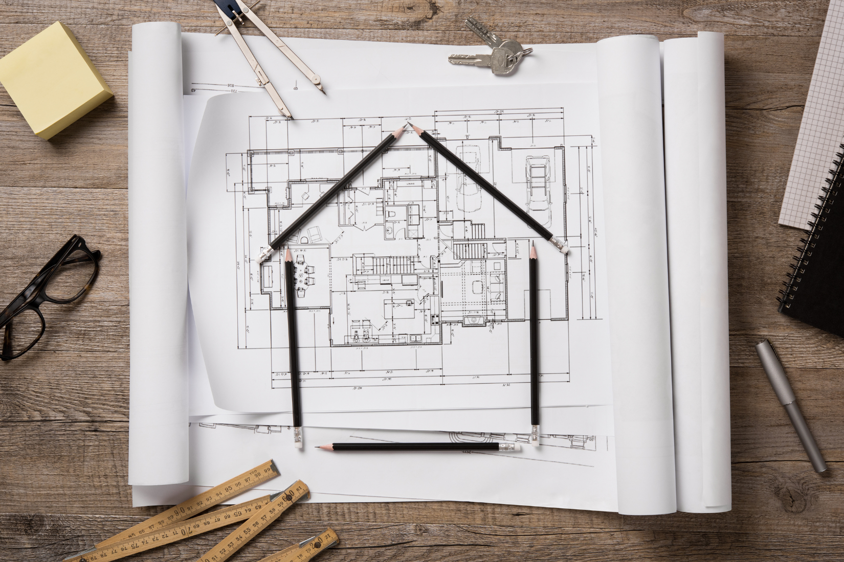 Home construction framing and blueprints representing experienced construction lending support in North Carolina