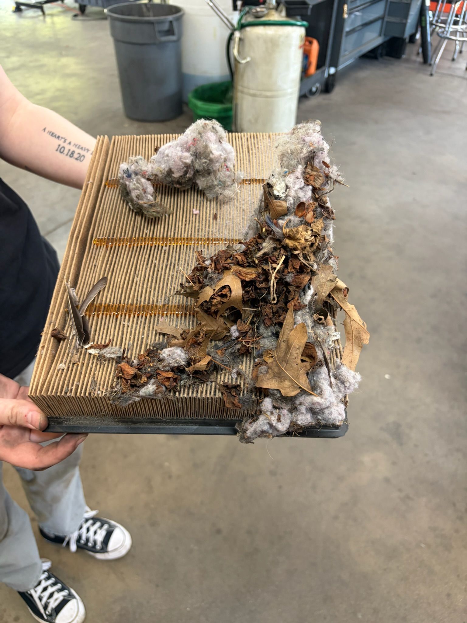 Unserviceable air filter completely filled with debris found by Beachview Auto Service
