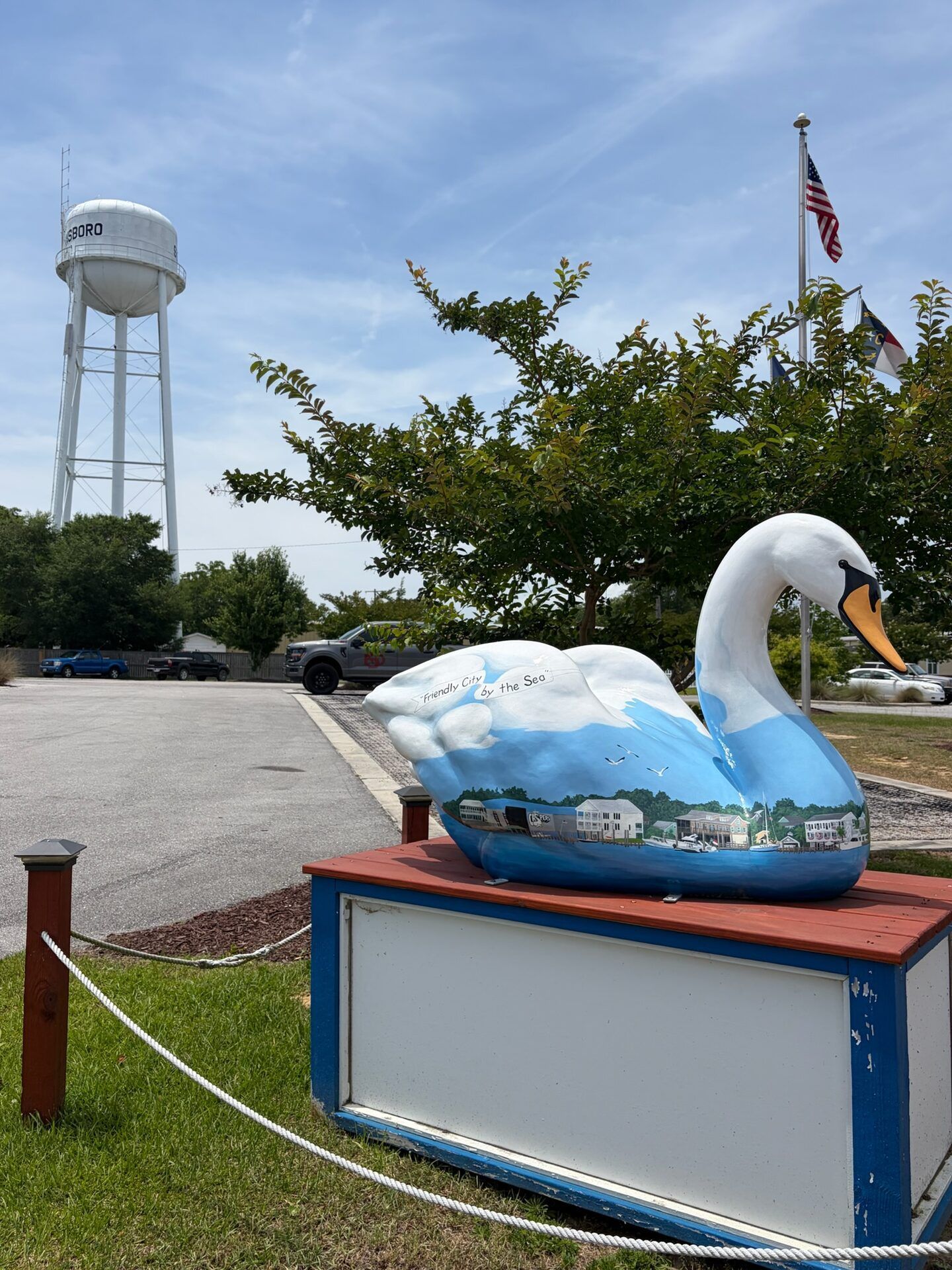 Painted swan statue and water tower in Swansboro, NC, the Friendly City by the Sea
